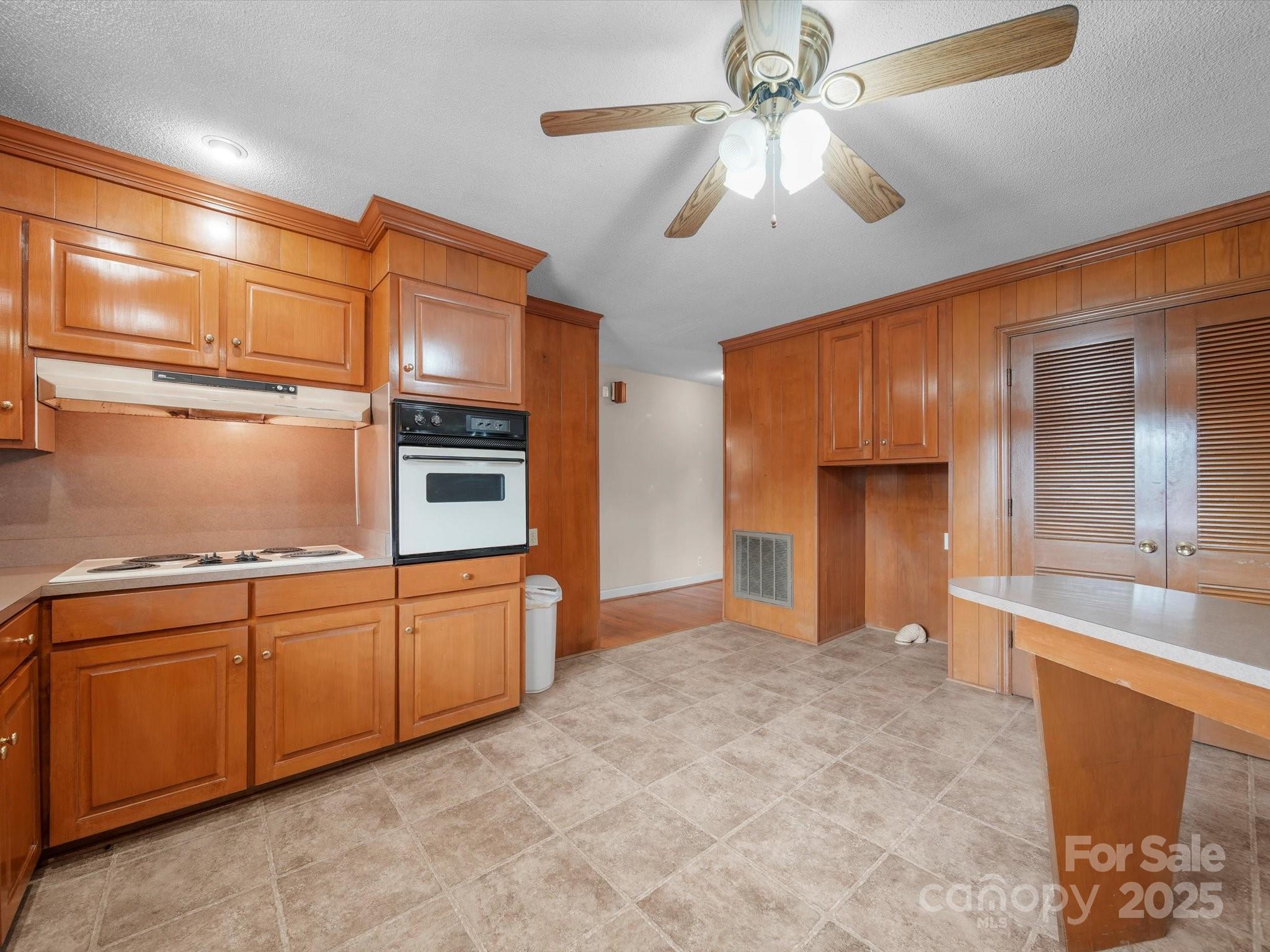 1497 White Store Road Pageland, SC 29728 - Photo 17 of 43 a kitchen with stainless steel appliances granite countertop a refrigerator a stove and a sink with cabinets