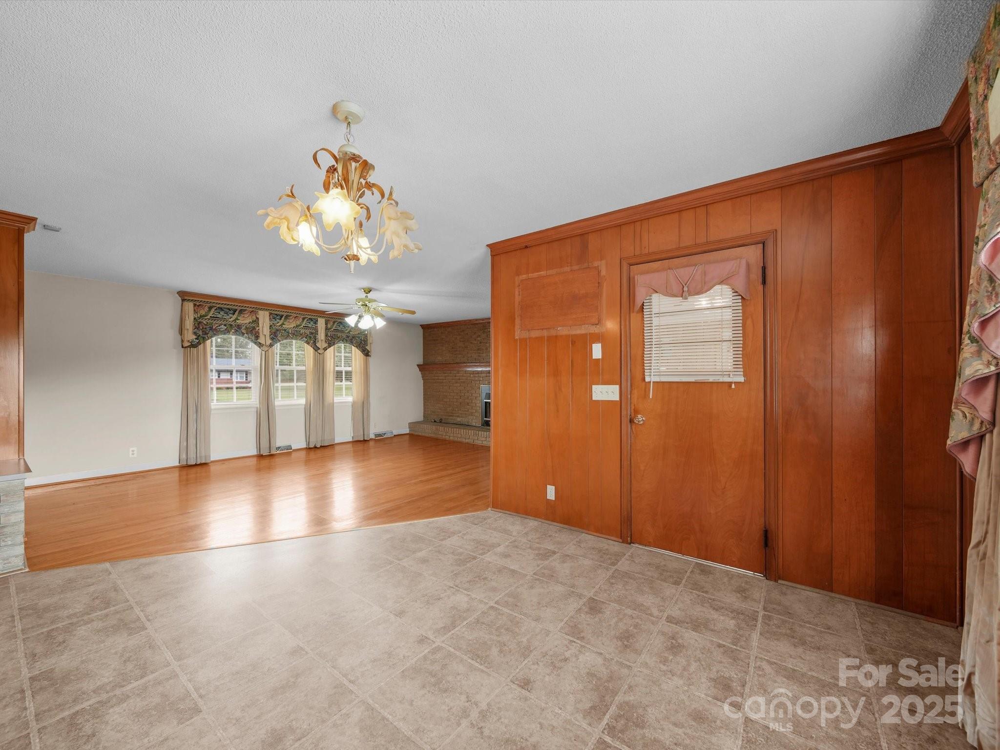 1497 White Store Road Pageland, SC 29728 - Photo 20 of 43 wooden floor in an empty room with a window