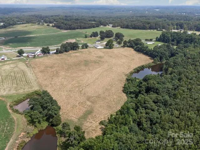 an aerial view of a houses with outdoor space and street view