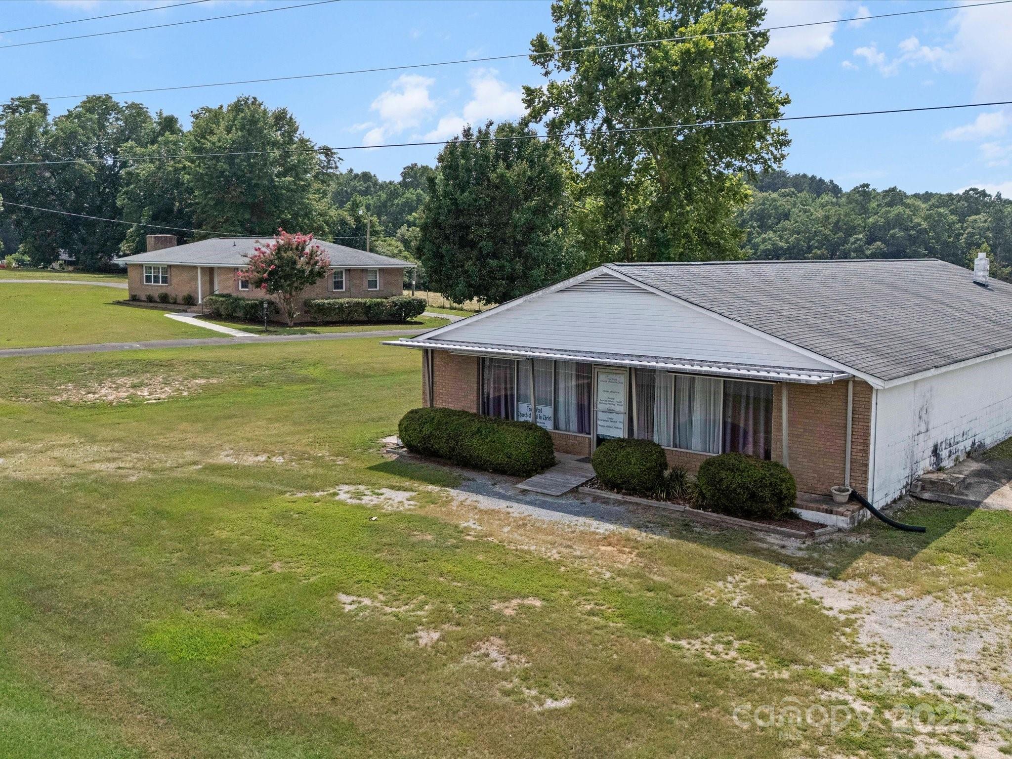 1497 White Store Road Pageland, SC 29728 - Photo 31 of 43 a front view of a house with garden and trees