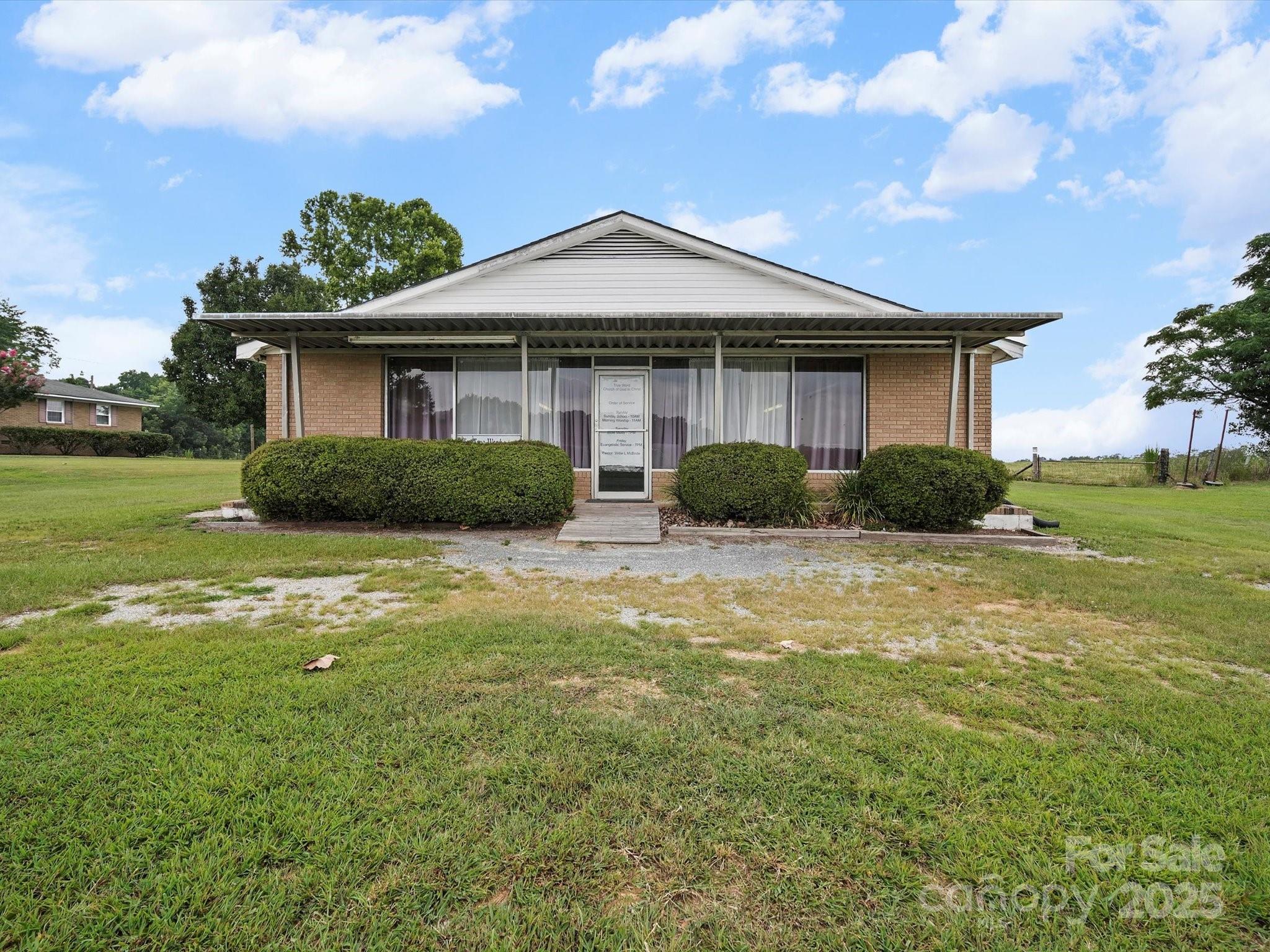 1497 White Store Road Pageland, SC 29728 - Photo 32 of 43 a front view of a house with a yard