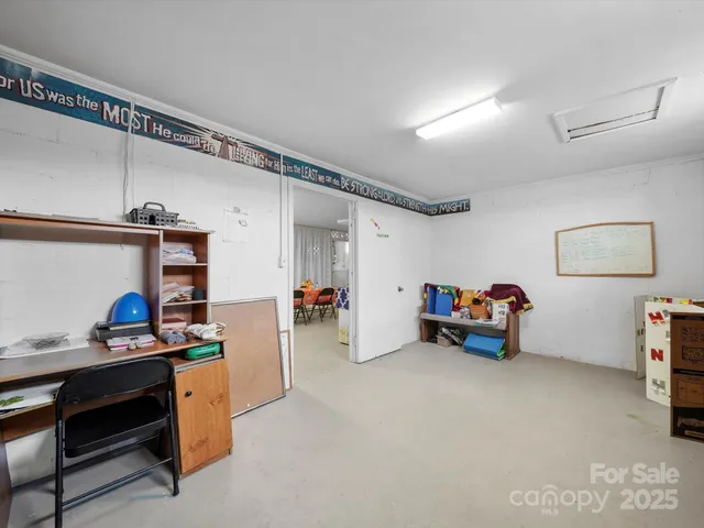 a bedroom with furniture and a ceiling fan