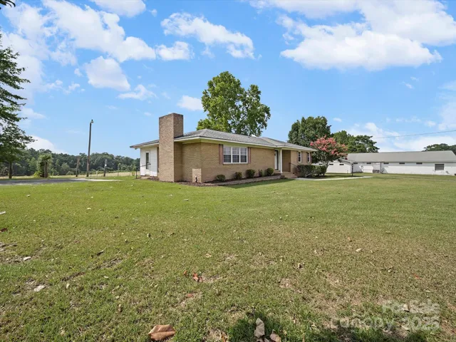 a view of a house with a big yard