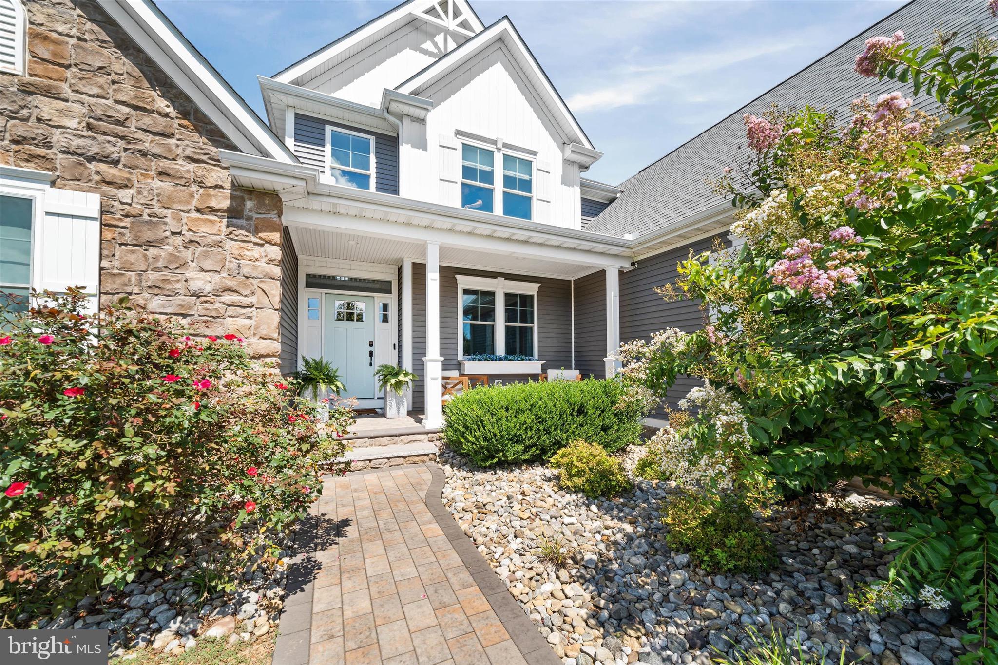1215 Bunker Hill Road Middletown, DE 19709 - Photo 1 of 54 a front view of a house with a yard and potted plants