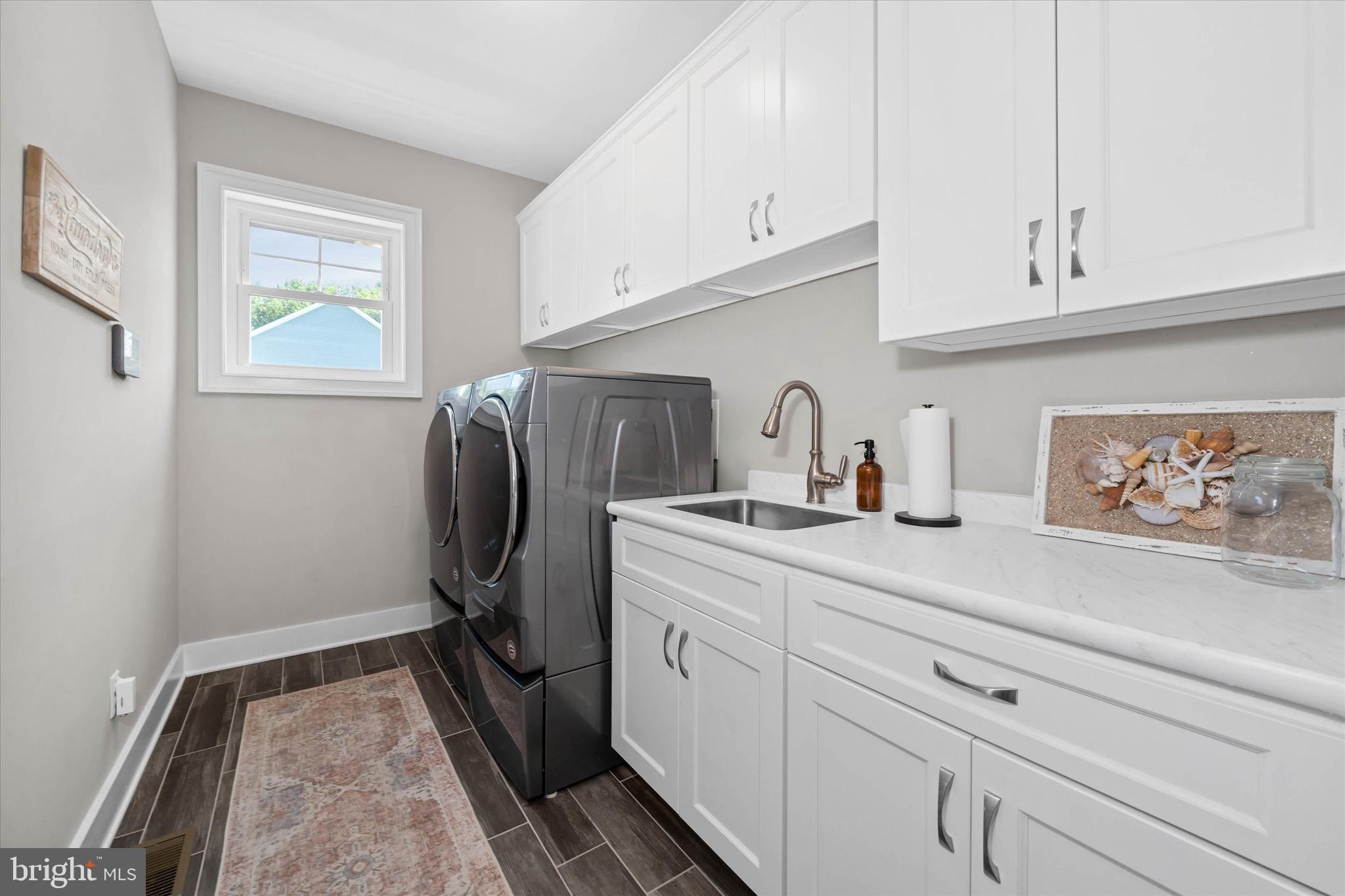 1215 Bunker Hill Road Middletown, DE 19709 - Photo 28 of 54 a utility room with cabinets washer and dryer