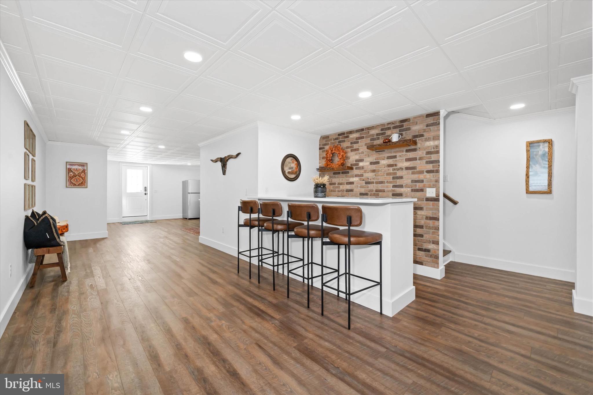 1215 Bunker Hill Road Middletown, DE 19709 - Photo 34 of 54 a view of a kitchen with dining space wooden floor electric appliances and windows