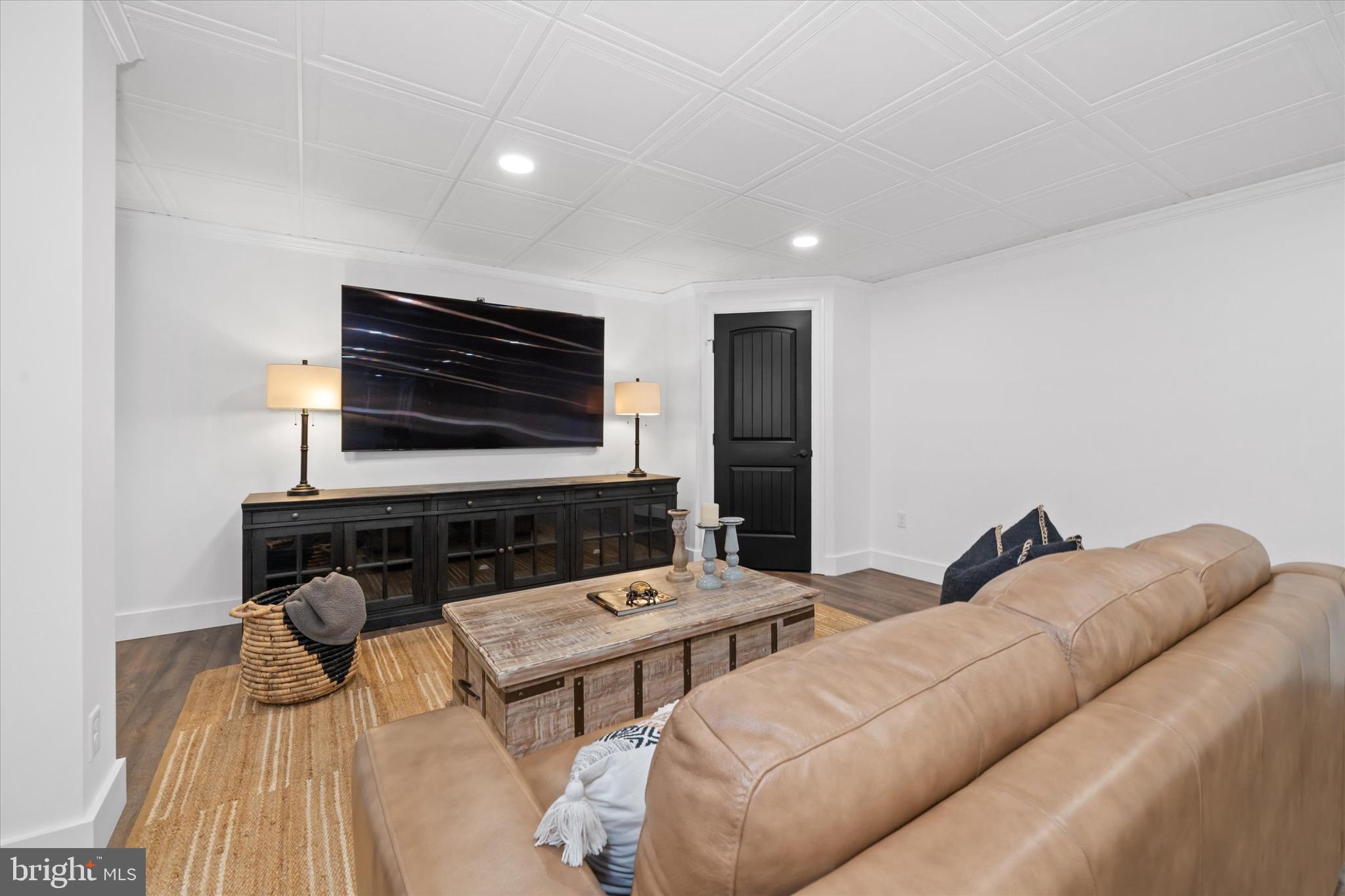 1215 Bunker Hill Road Middletown, DE 19709 - Photo 36 of 54 a living room with furniture and a flat screen tv