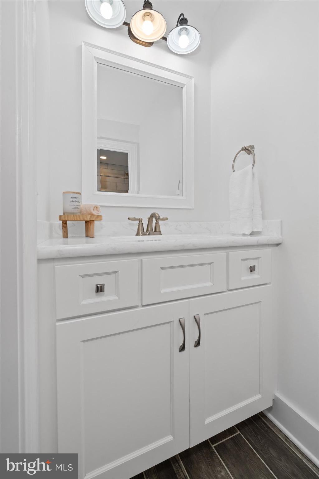 1215 Bunker Hill Road Middletown, DE 19709 - Photo 45 of 54 a bathroom with a sink and a mirror