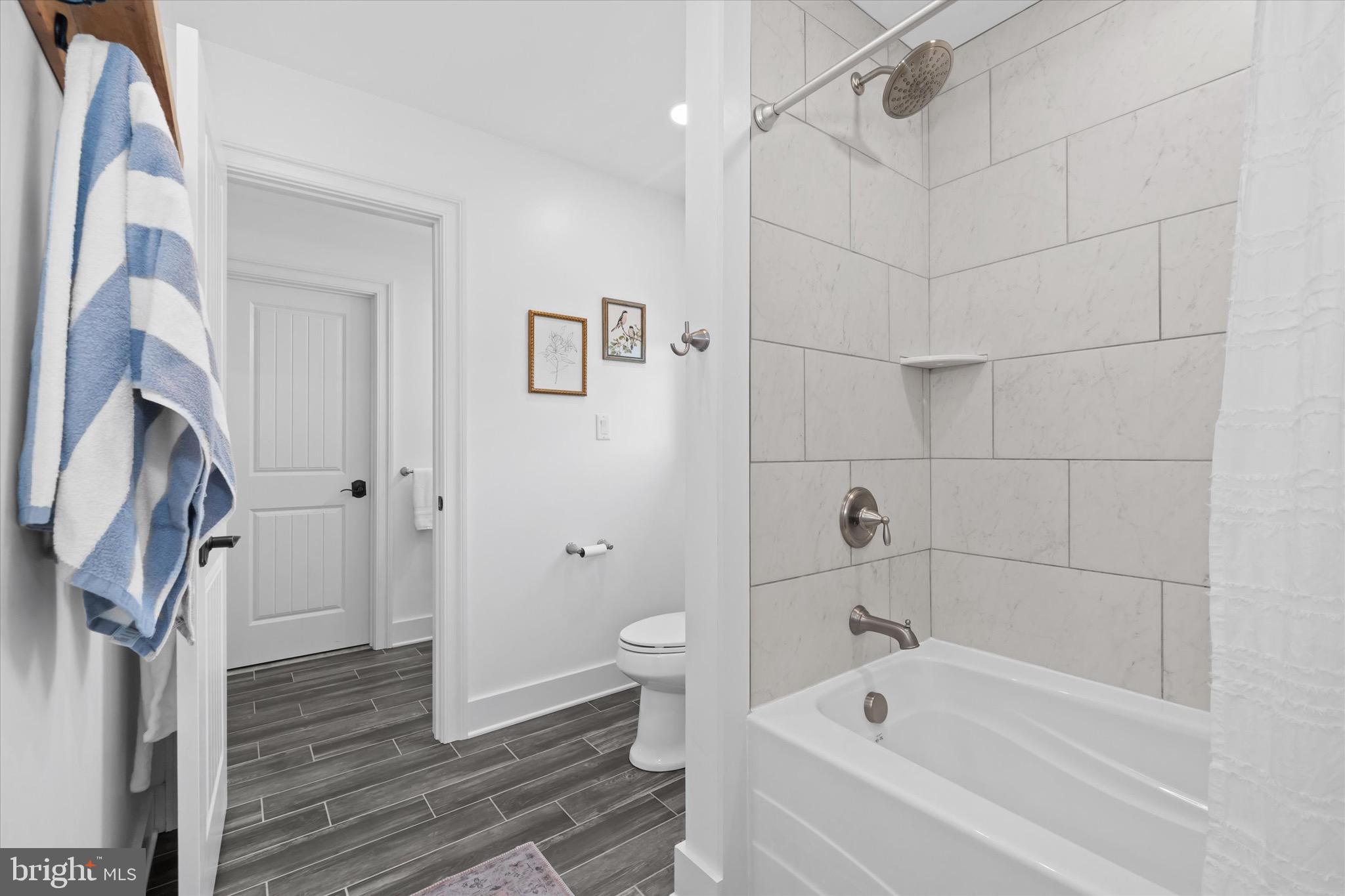 1215 Bunker Hill Road Middletown, DE 19709 - Photo 47 of 54 a bathroom with a bathtub and a shower