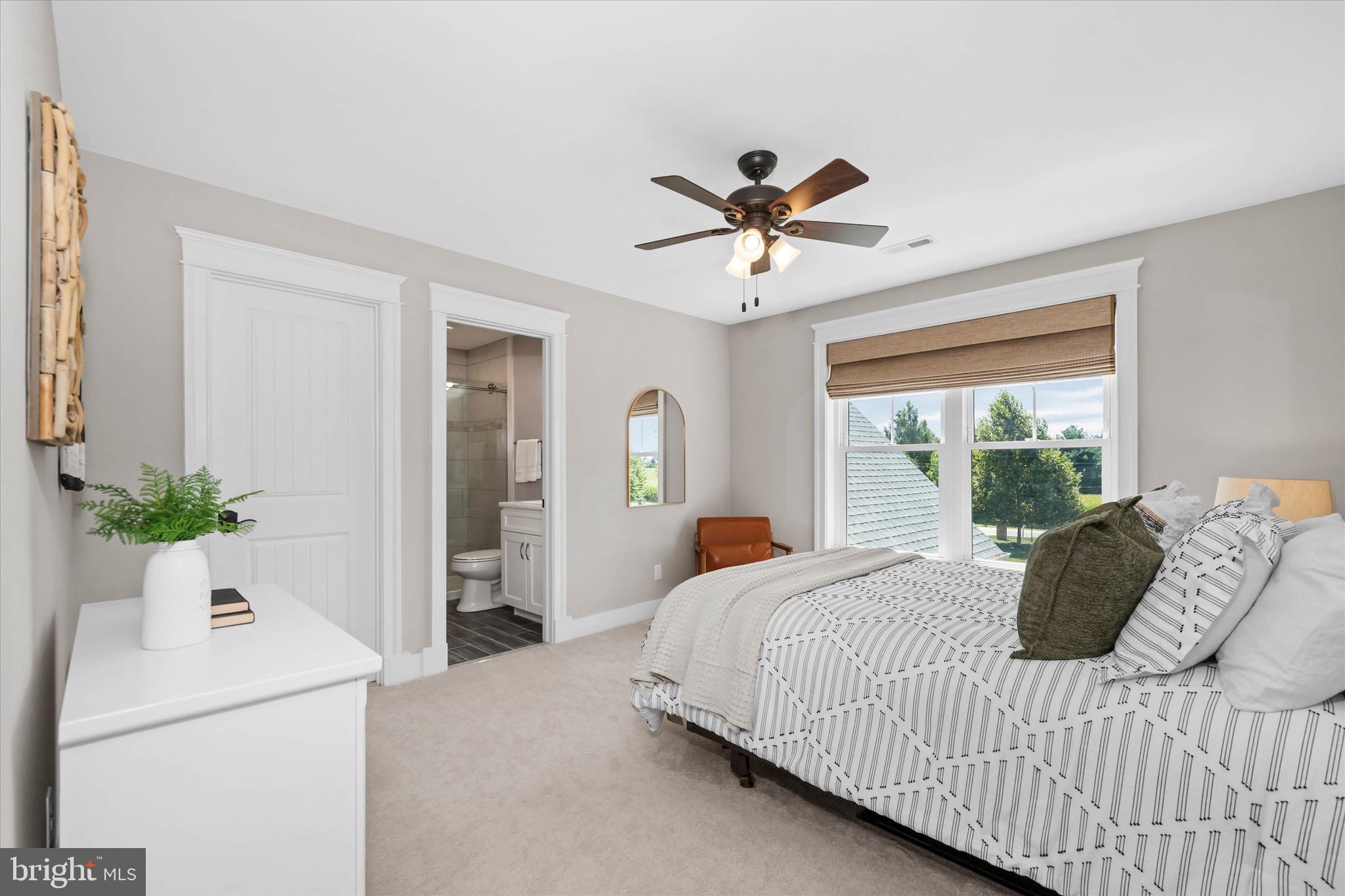 1215 Bunker Hill Road Middletown, DE 19709 - Photo 48 of 54 a bedroom with a large bed and a chandelier