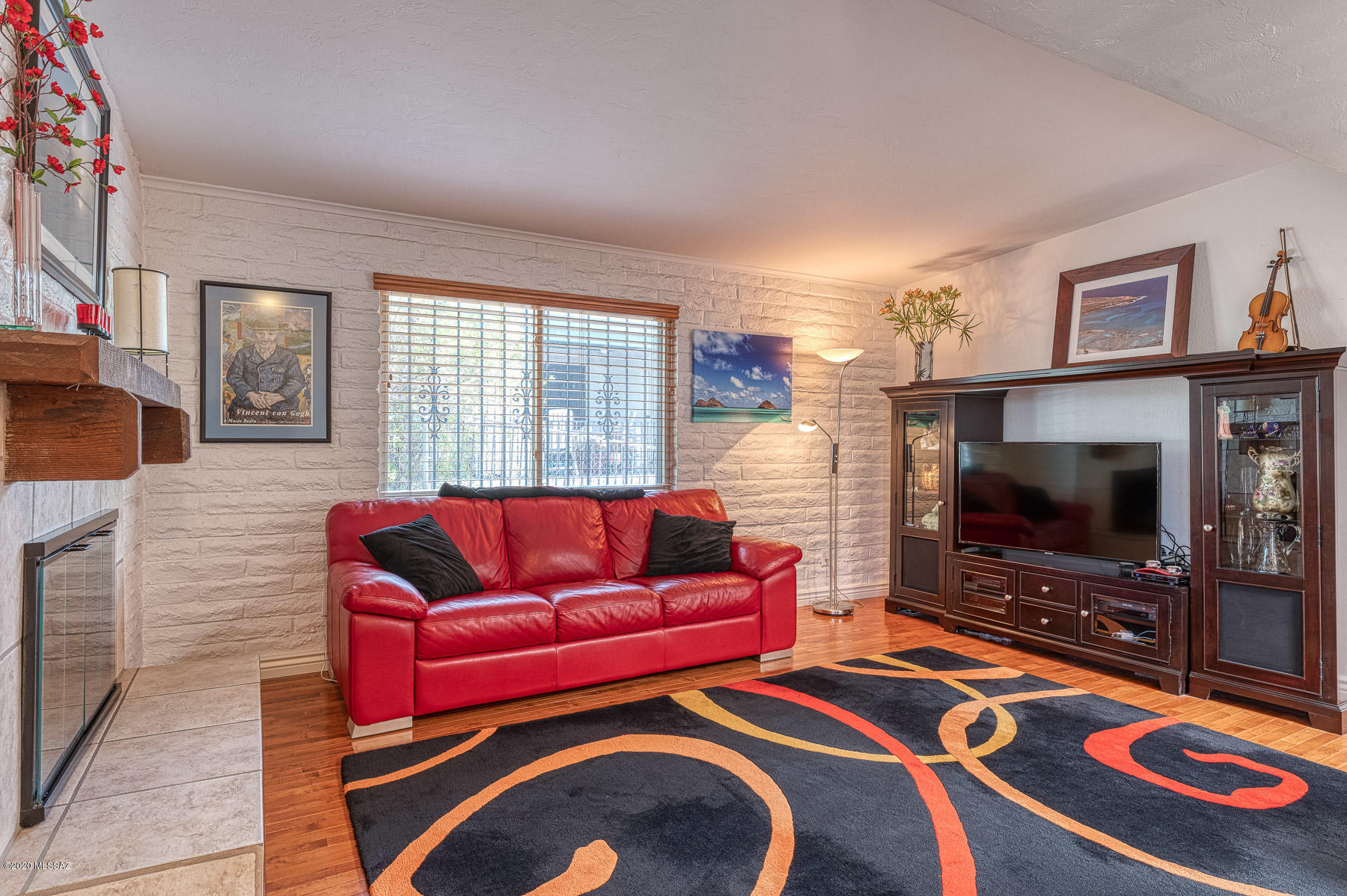 1825 North Old Ranch Road Tucson, AZ 85745 - Photo 5 of 35 a living room with furniture and a flat screen tv