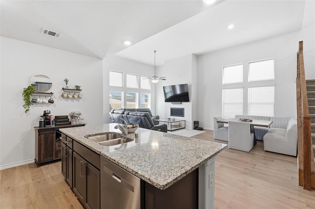 103 Lantern Road Caddo Mills, TX 75135 - Photo 12 of 33 a kitchen with sink refrigerator and window