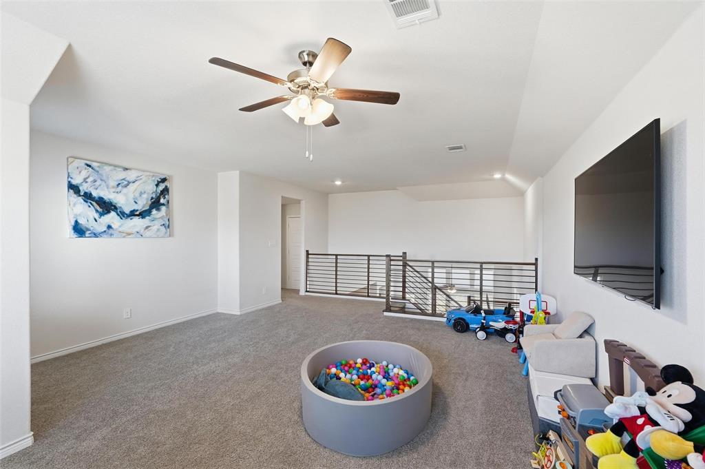 103 Lantern Road Caddo Mills, TX 75135 - Photo 16 of 33 a living room with furniture and a flat screen tv