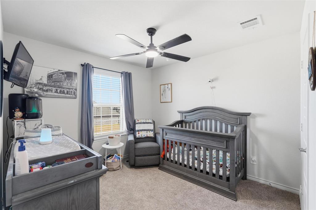 103 Lantern Road Caddo Mills, TX 75135 - Photo 22 of 33 a bedroom with furniture and a window