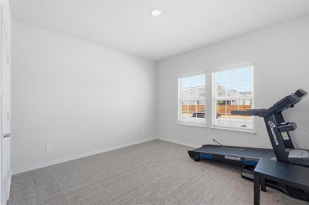 103 Lantern Road Caddo Mills, TX 75135 - Photo 23 of 33 a room with gym equipment and a window