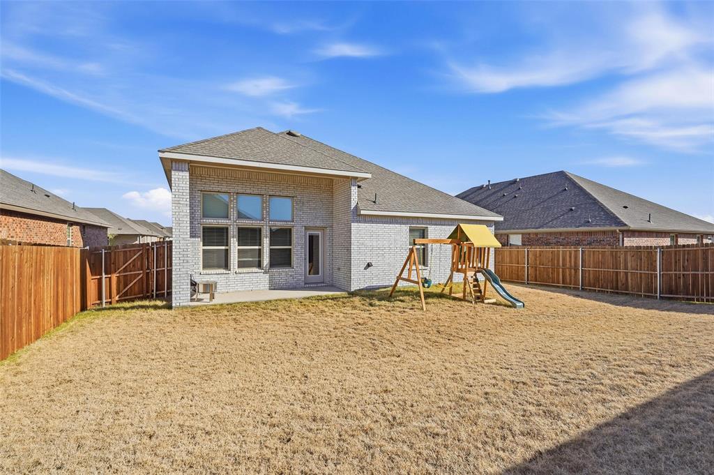 103 Lantern Road Caddo Mills, TX 75135 - Photo 28 of 33 a view of a house with a yard