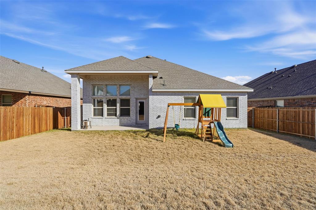 103 Lantern Road Caddo Mills, TX 75135 - Photo 29 of 33 a front view of a house with a yard