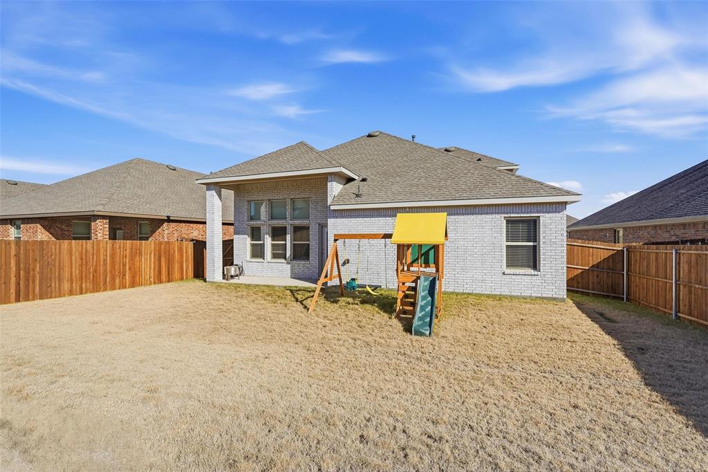 103 Lantern Road Caddo Mills, TX 75135 - Photo 30 of 33 a house with yard in front of it