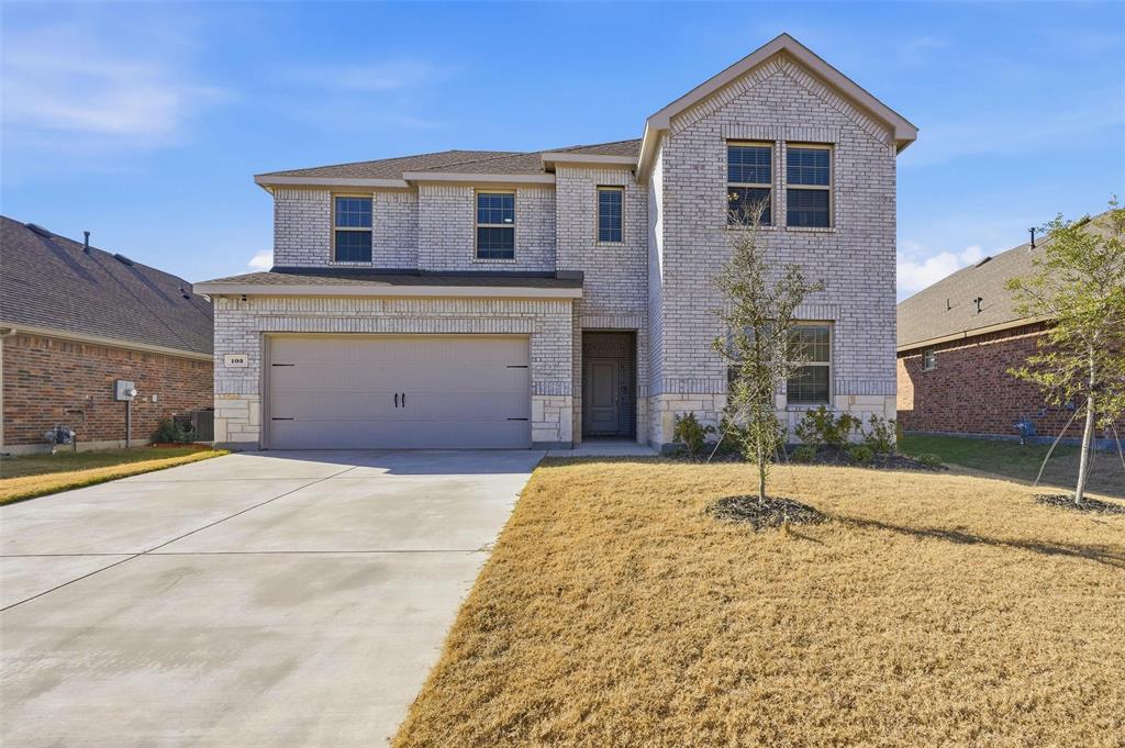103 Lantern Road Caddo Mills, TX 75135 - Photo 3 of 33 a front view of a house with a yard and garage
