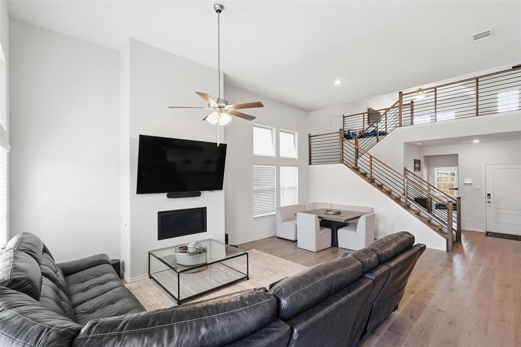 103 Lantern Road Caddo Mills, TX 75135 - Photo 4 of 33 a living room with furniture and a flat screen tv