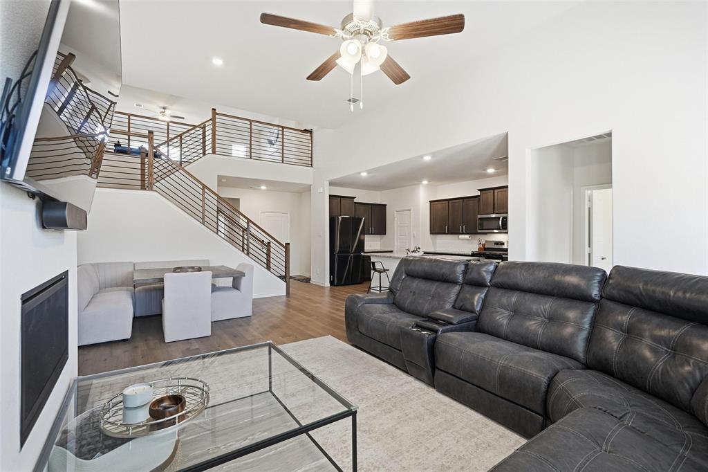 103 Lantern Road Caddo Mills, TX 75135 - Photo 5 of 33 a living room with furniture and a chandelier