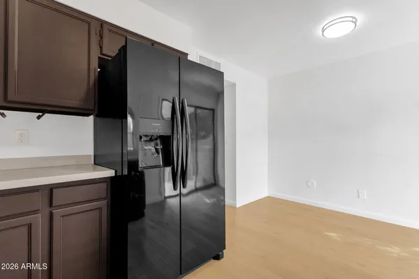 a kitchen with a sink and wooden cabinets