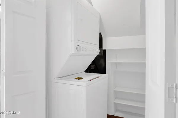a kitchen with stainless steel appliances granite countertop a stove sink and cabinets