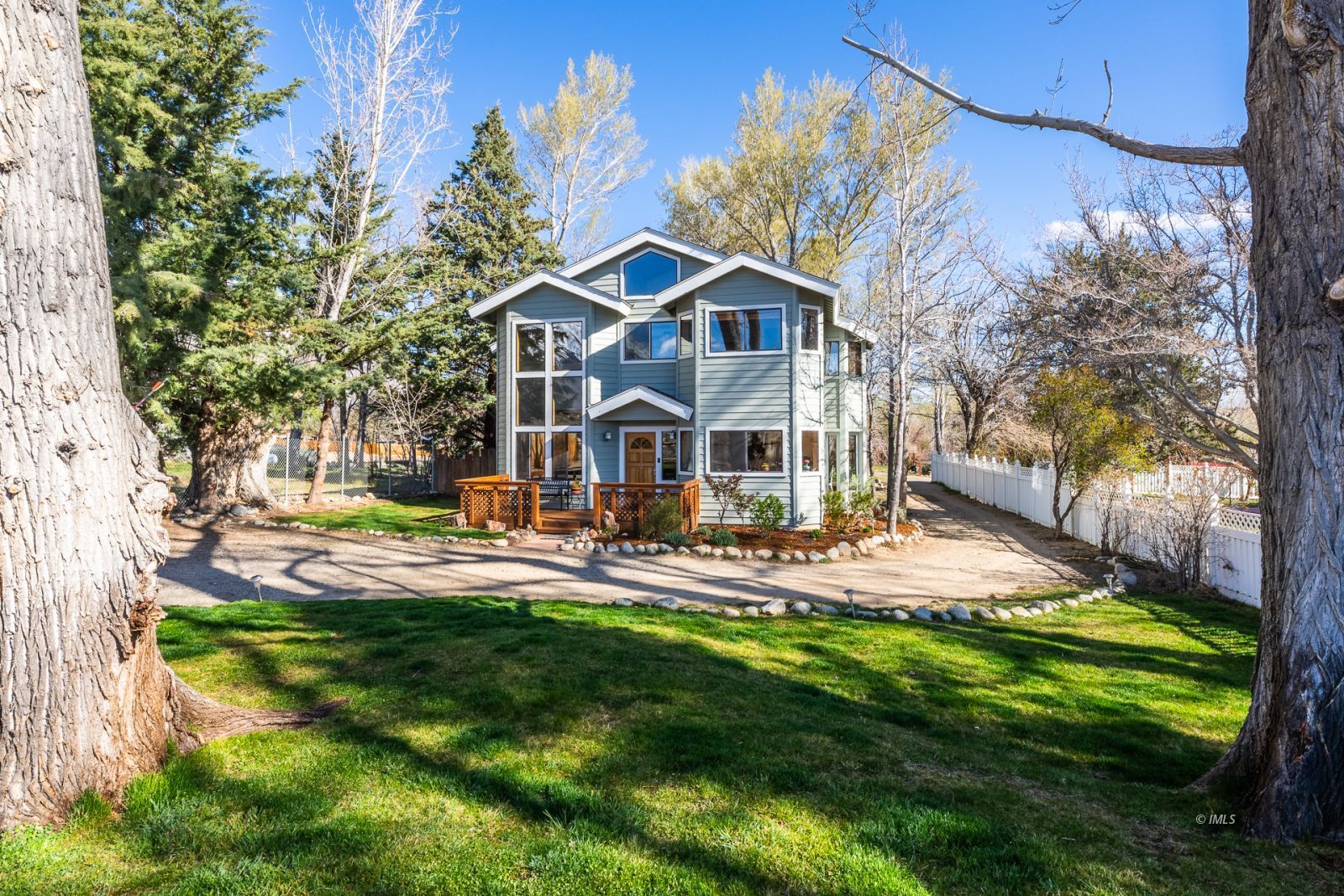 a view of a house with a yard patio and swimming pool