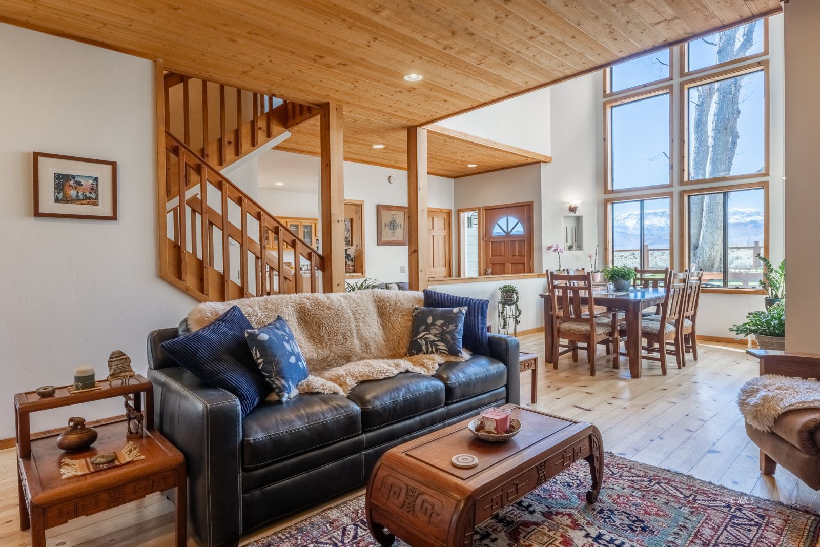 150 Hardy Road Bishop, CA 93514 - Photo 11 of 35 a living room with furniture wooden floor and a large window
