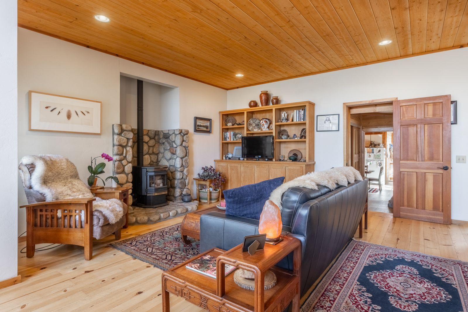 150 Hardy Road Bishop, CA 93514 - Photo 12 of 35 a living room with furniture fireplace and wooden floor