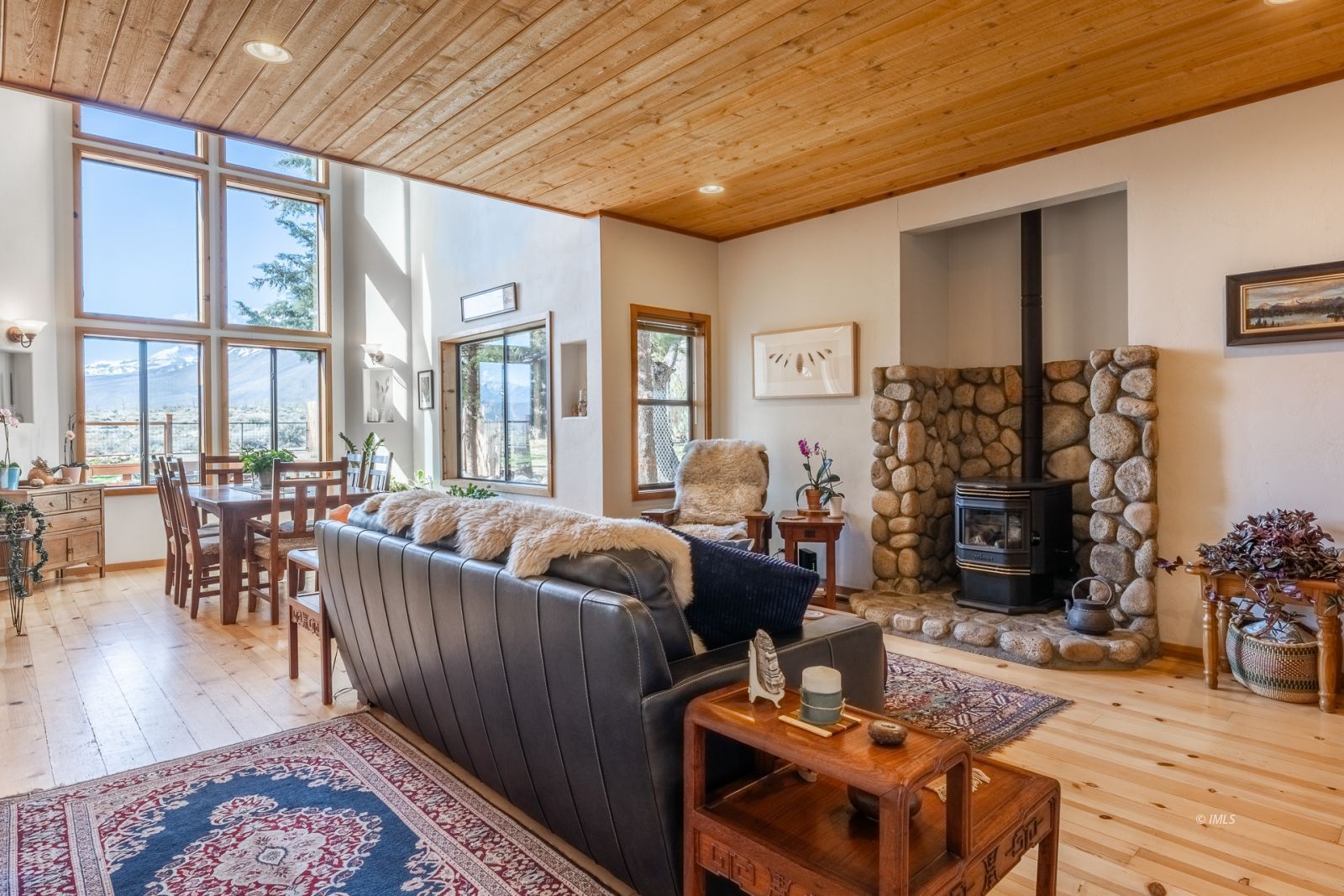 150 Hardy Road Bishop, CA 93514 - Photo 14 of 35 a living room with furniture a rug and a floor to ceiling window
