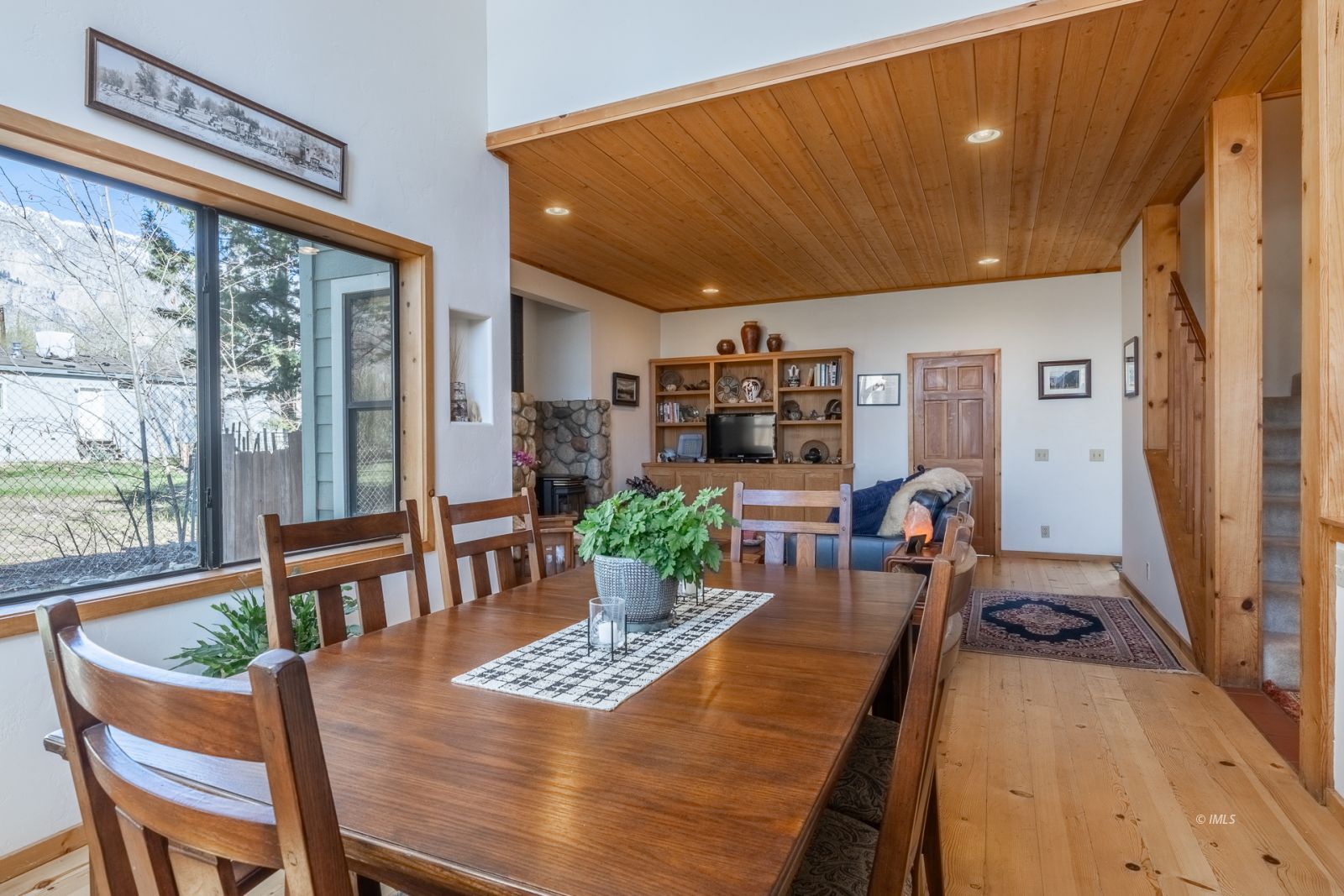150 Hardy Road Bishop, CA 93514 - Photo 16 of 35 a view of a dining room with furniture window and wooden floor