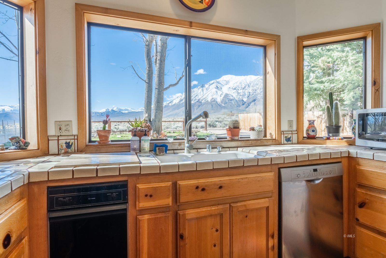 150 Hardy Road Bishop, CA 93514 - Photo 17 of 35 a kitchen with stainless steel appliances granite countertop a stove and a sink