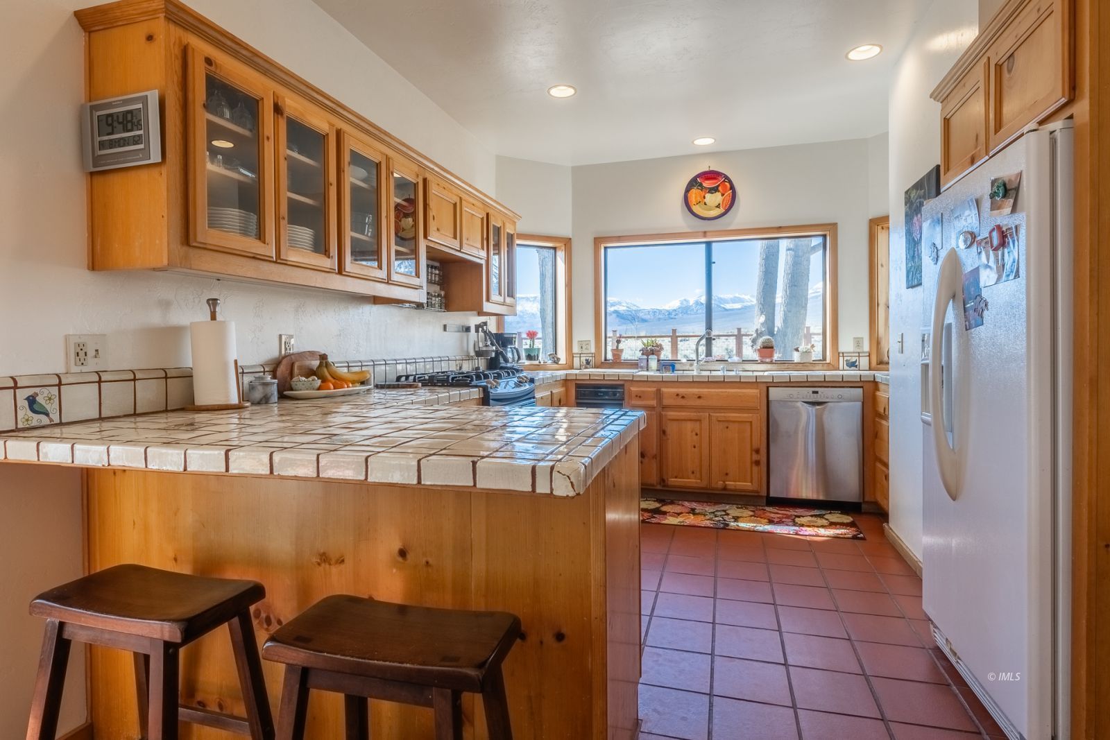 150 Hardy Road Bishop, CA 93514 - Photo 18 of 35 a kitchen with stainless steel appliances granite countertop a sink and cabinets