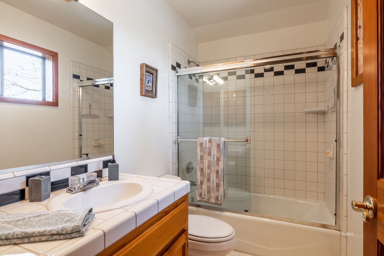 150 Hardy Road Bishop, CA 93514 - Photo 27 of 35 a bathroom with a granite countertop bathtub shower sink vanity mirror and toilet