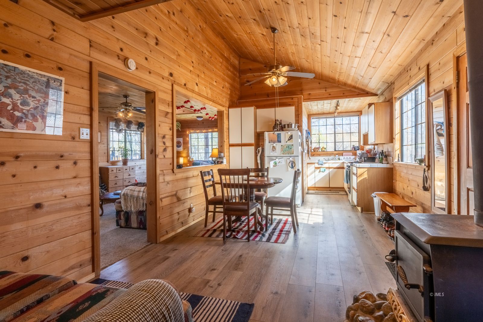150 Hardy Road Bishop, CA 93514 - Photo 30 of 35 a dining room with wooden floors and large windows