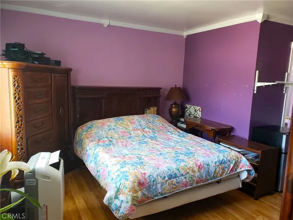 a bedroom with a bed and a closet