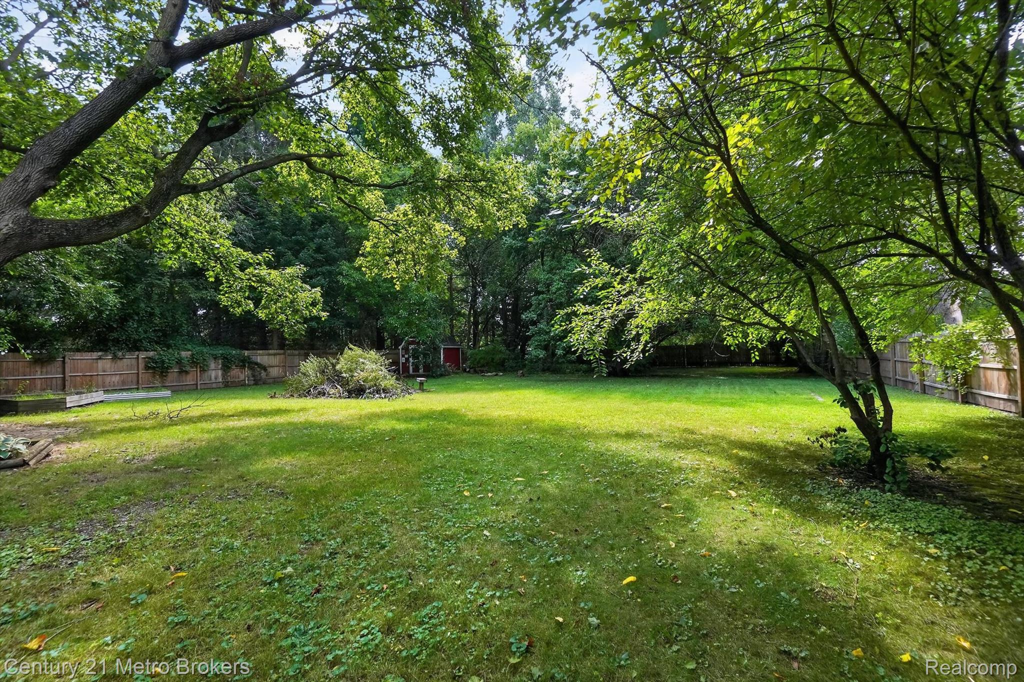 4575 Brockway Road Saginaw, MI 48638 - Photo 41 of 44 Expansive grassy yard with mature trees providing natural shade