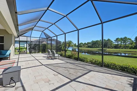 a view of a patio with a table chairs and balcony