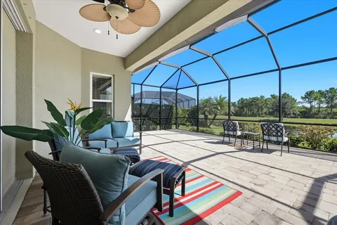 a view of a livingroom with furniture and a patio