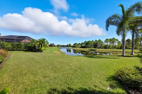 a view of a garden with a building in the background