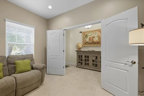 a living room with furniture and a window