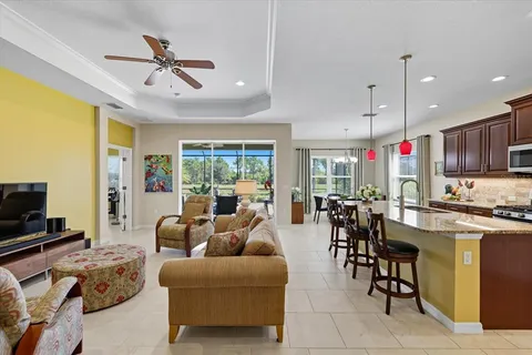 a living room with fireplace furniture and a flat screen tv
