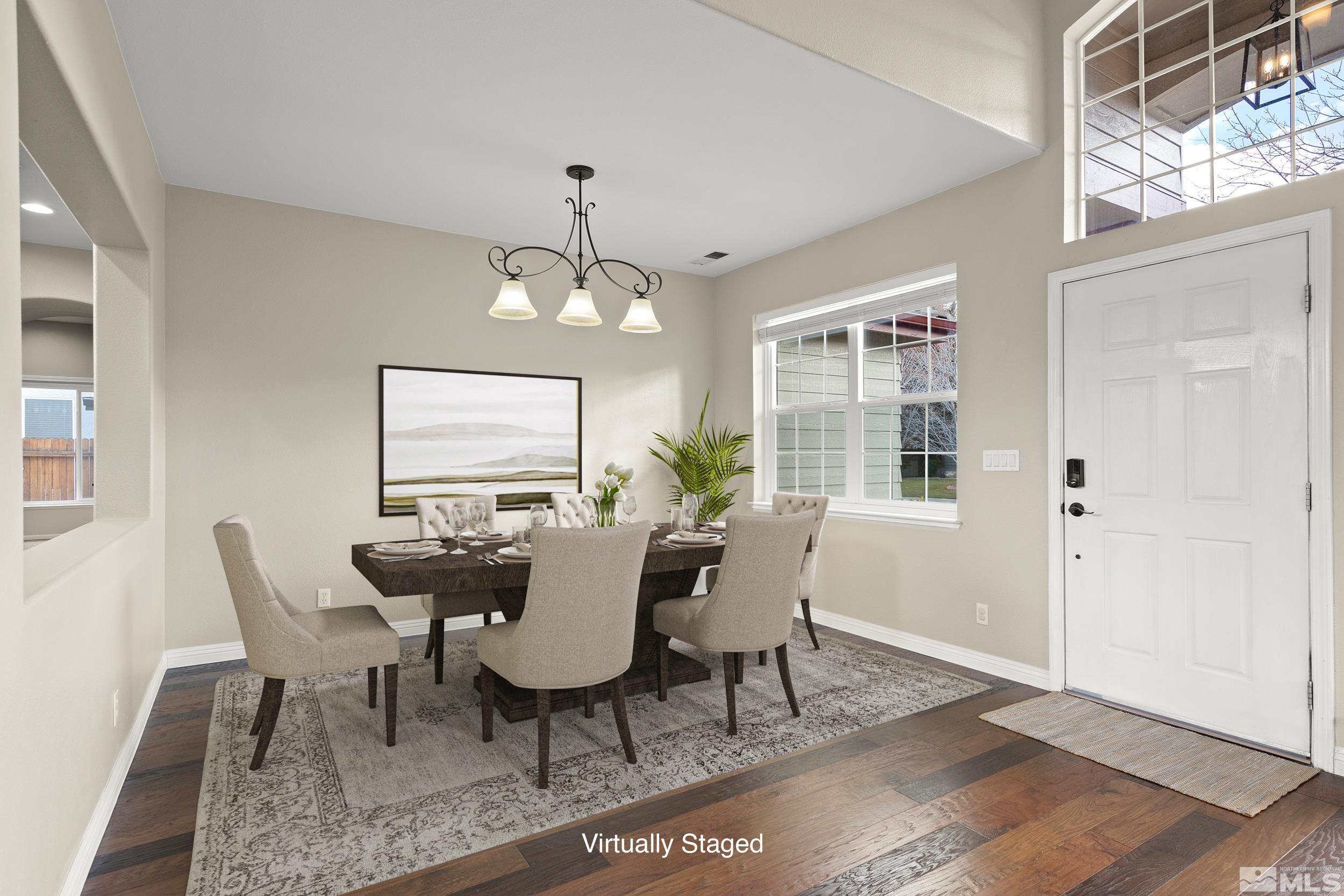 9965 Bandana Way Reno, NV 89521 - Photo 15 of 40 a view of a dining room with furniture window and wooden floor