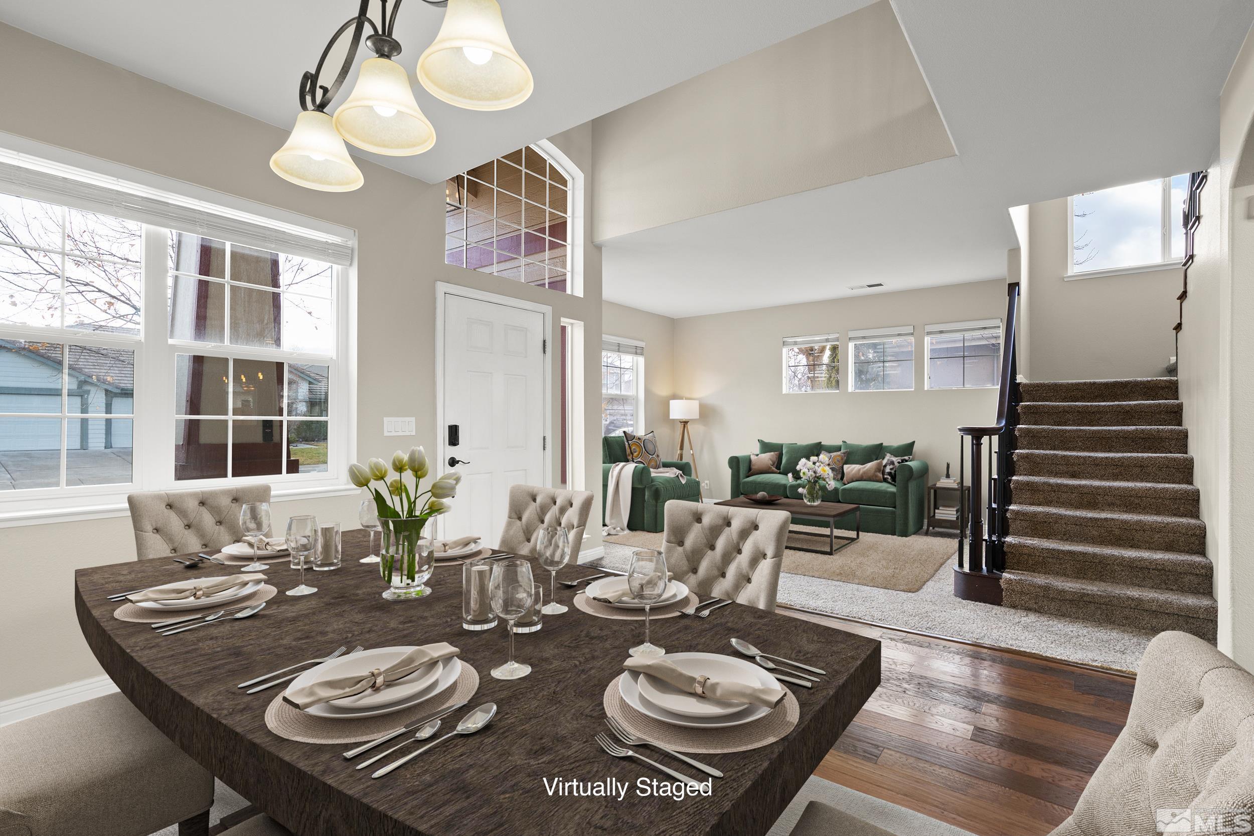 9965 Bandana Way Reno, NV 89521 - Photo 16 of 40 a view of a dining room with furniture wooden floor and chandelier