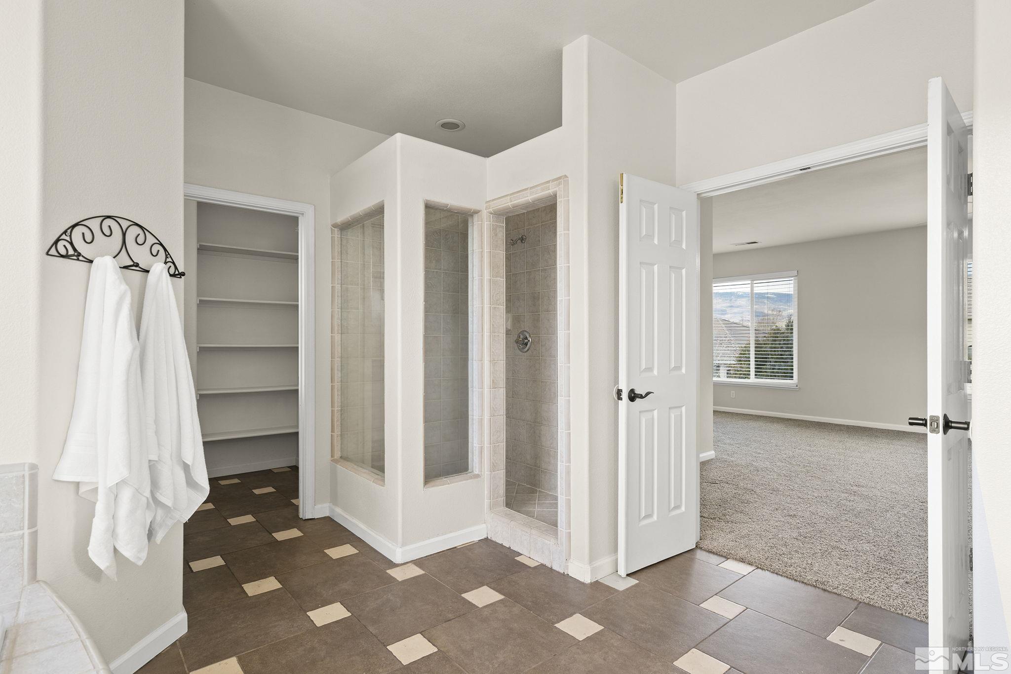 9965 Bandana Way Reno, NV 89521 - Photo 18 of 40 a view of walk in closet with empty racks