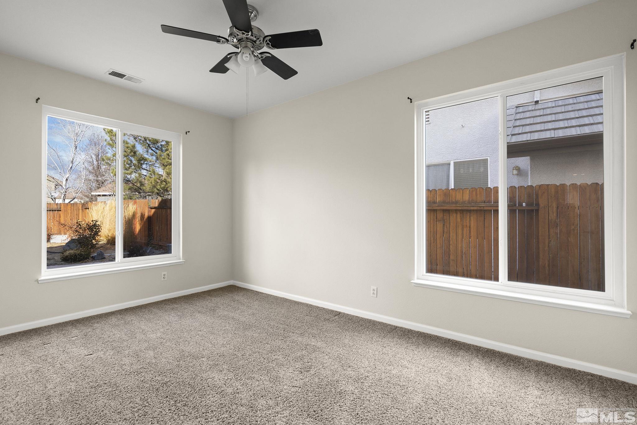 9965 Bandana Way Reno, NV 89521 - Photo 23 of 40 an empty room with windows and fan