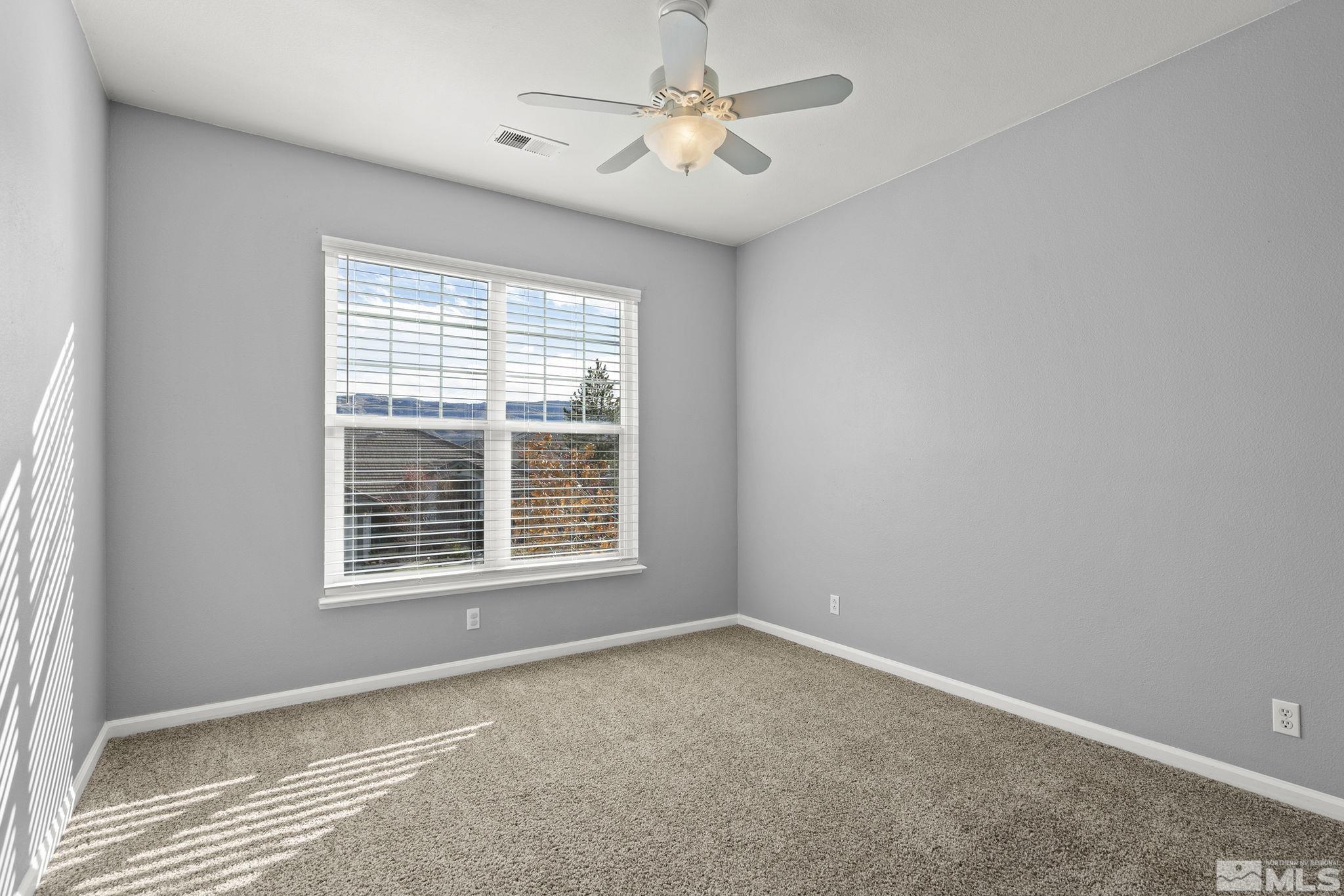 9965 Bandana Way Reno, NV 89521 - Photo 27 of 40 a view of an empty room with a window