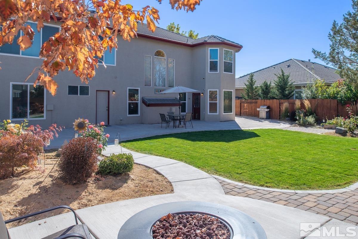 9965 Bandana Way Reno, NV 89521 - Photo 36 of 40 a front view of a house with garden and sitting area