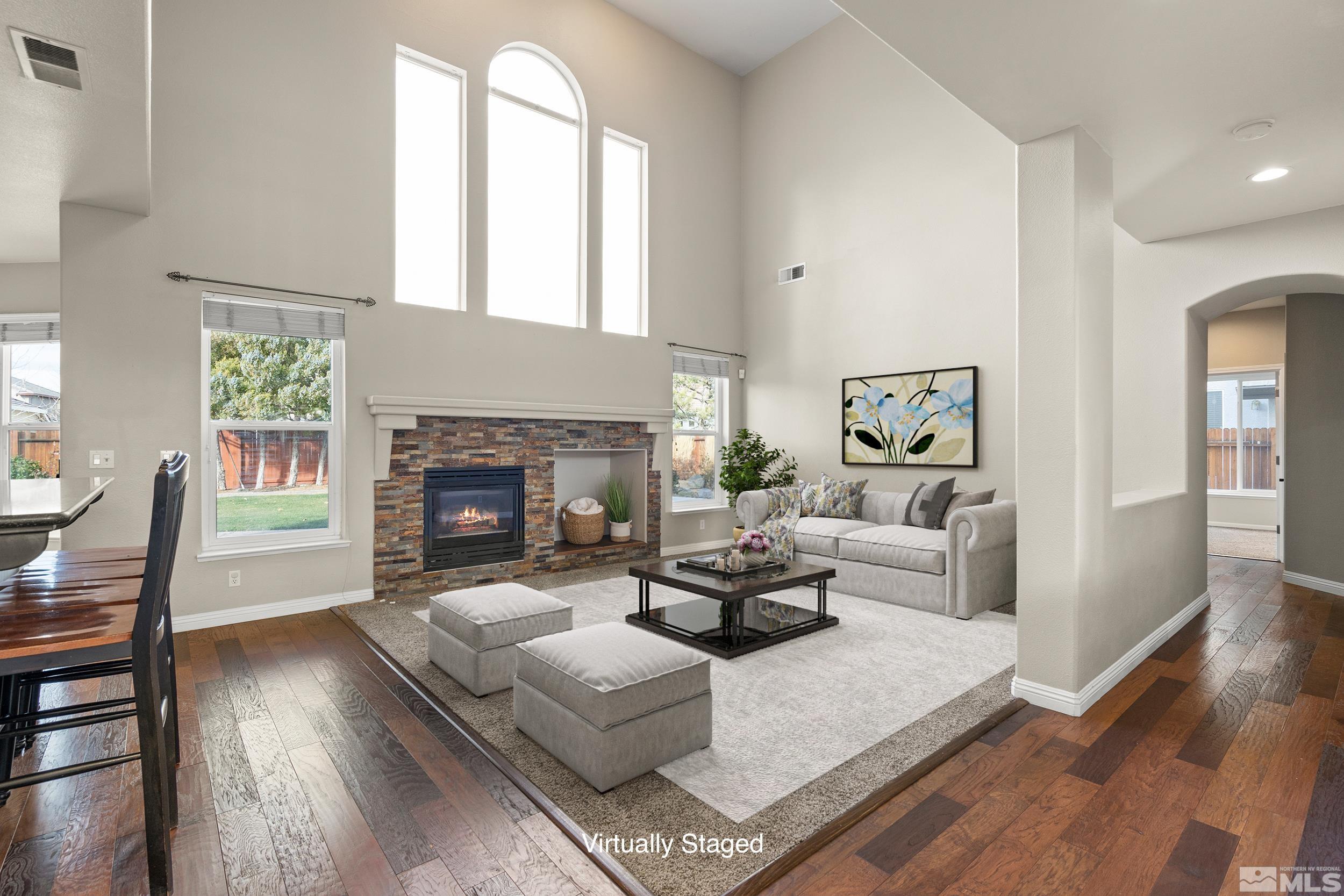 9965 Bandana Way Reno, NV 89521 - Photo 4 of 40 a living room with furniture and a fireplace